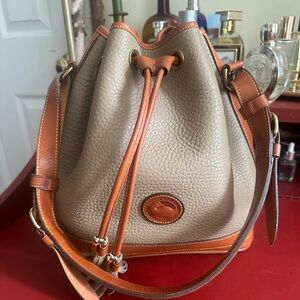 Dooney & Bourke tassel bucket bag brown & tan pebbled leather with accent gold
